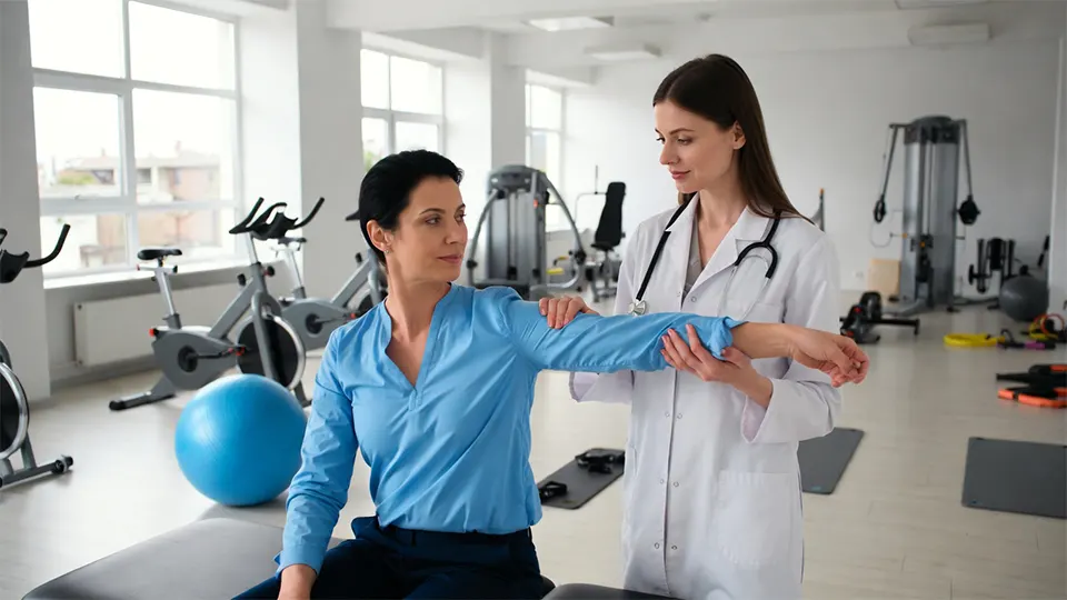 Licensed physiotherapist conducting a shoulder assessment in a top-rated clinic.