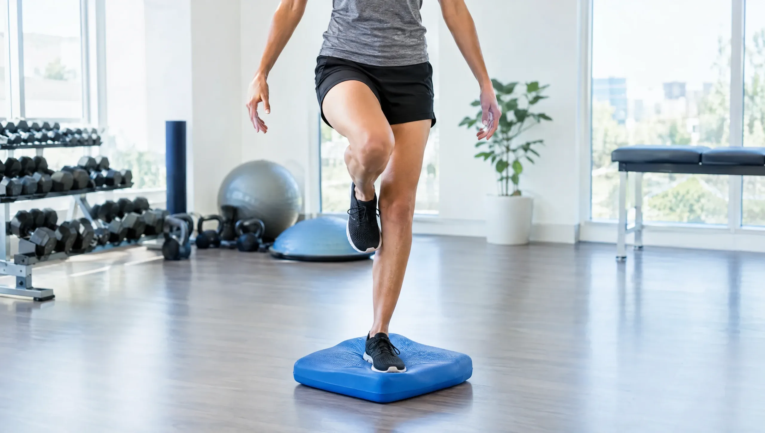 Person performing single-leg balance training exercise to help prevent future ankle sprains