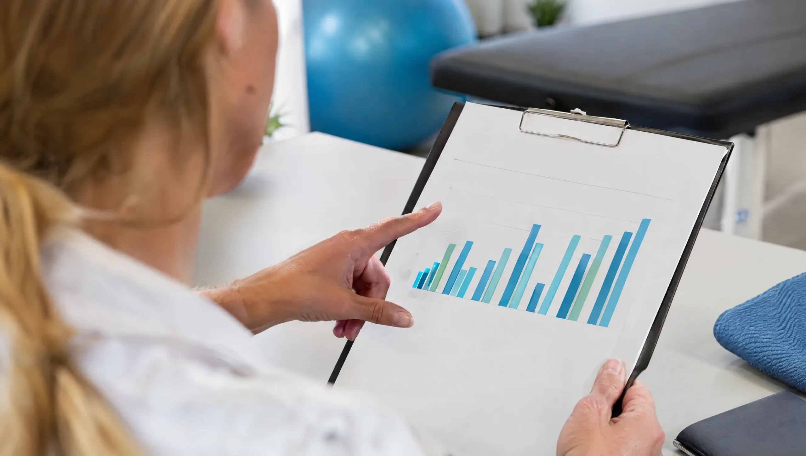 Close-up of a neck disability index results chart being reviewed
