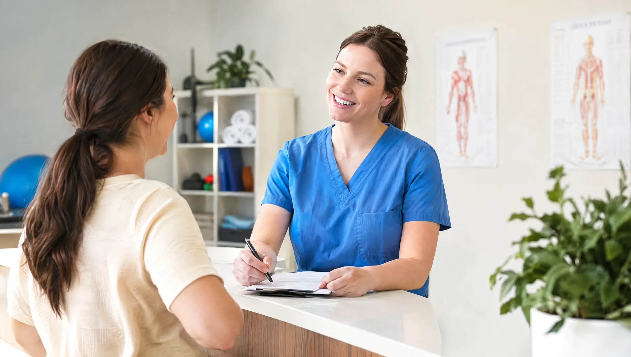 Physiotherapist consulting with a patient about tennis elbow and golfers elbow questions